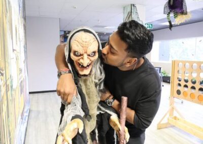 Surtech employee strikes a pose with a spooky skeleton for Halloween