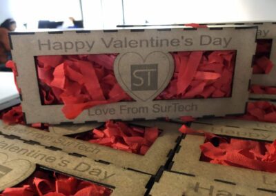A beautifully adorned gift box with Surtech branding, perfect for Valentine's Day