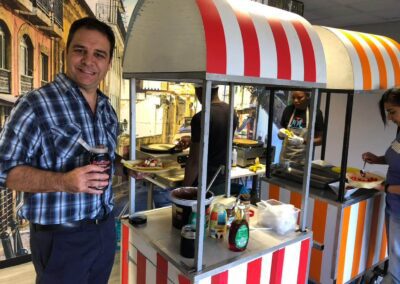Male Surtech employee savoring waffles at the waffle stand on Waffle Day
