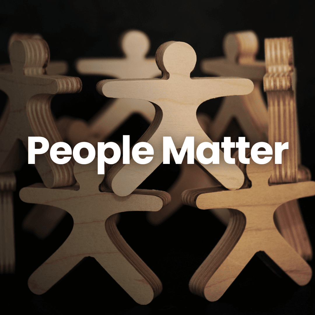 Wooden stick figures forming a circle, symbolizing SurTech's emphasis on the value of people.